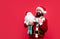 Thank you. happy new year. merry christmas. cheerful bearded man in santa claus costume. hipster celebrate xmas party