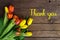 Thank You Message, Colorful tulips on wooden background. Spring flower background with blooming tulips, mockup template.