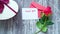 thank you message, envelope and rose flower on wooden table