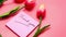 Thank you message on sticky note with tulip flower on pink background