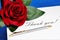 Thank you word on a piece of paper and gift a red rose. Thank you â€” the Polite word for it, expresses gratitude, satisfaction, a