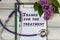 THANKS FOR THE TREATMENT - words on a white sheet on a light background with a sprig of lilac and stethoscope