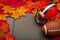 Thanksgiving american football game concept with copy space, a generic helmet and ball on the pavement surrounded by fall foliage