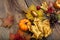 Thanksgiving arrangement with golden leaves and pumpkins