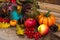 Thanksgiving arrangement with rowan, pumpkin and turquoise vase