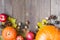 Thanksgiving autumn fall background with pumpkin, leaves, apples, pine cones and nuts
