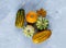 Thanksgiving day composition of vegetables and fruits on gray background. Autumn harvest concept.