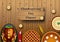 Thanksgiving dinner background with turkey and all sides dishes, pumpkin pie, fall leaves and seasonal autumnal decor on wooden