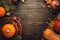 Thanksgiving dinner place setting. Autumn fruit, pumpkins, nuts, fallen leaves with plate and cutlery. Thanksgiving autumn