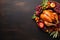 Thanksgiving dinner. Roasted turkey or chicken with autumn fruits on wooden background.