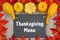 Thanksgiving Menu on chalkboard with gourds