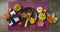 Thanksgiving party banner concept with plate, pumpkin and autumn leaves on dark background. Top view, flat lay