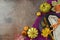 Thanksgiving party concept with plate, pumpkin and autumn leaves on dark background. Top view, flat lay