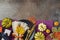 Thanksgiving party concept with plate, pumpkin and autumn leaves on dark background. Top view, flat lay