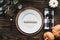 Thanksgiving place setting with grateful message over a wood background