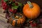 Thanksgiving rustic decor with viburnum and pumpkins