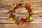 Thanksgiving wreath with rowan leaves and ripe berries, top view