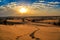 Thar desert sunset at Jaisalmer Rajasthan, India with moody vibrant sky