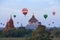 Thatbyinnyu Temple and hot air balloons flying over Bagan, Myanmar