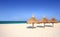 Thatch palapa umbrellas on resort beach