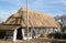 Thatch roof being renewed