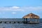 Thatched Cabana on Dock with Cancun on the Horizon