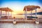 Thatched canopies and awnings on the beach Copacabana at sunset in Dubrovnik