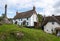 Thatched cottages by the village green of Lustleigh in Devon