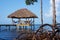 Thatched hut with hammock over the sea