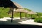 Thatched hut on a stretch of beach overlooking the Caribbean Sea