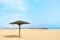 Thatched Parasol on an empty Gold Beach. Dubai