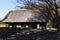 A thatched-roof dwelling of a wealthy farmer.