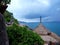 Thatched roof of a small bungalow on the beach against the blue sea