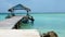 Thatched roofed jetty of Pigeon Point Beach in the Caribean sea on Tobago