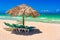 Thatched umbrellas and beach beds on a cuban beach