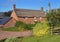 Thatched Village Cottage next to a rural lane