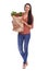 Thats my grocery shopping done. Studio shot of a young woman carrying a bag of groceries isolated on white.