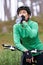 Thats so refreshing. an attractive young cyclist pausing to drink some water.
