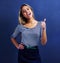 Thats the spirit. A studio portrait of a happy young woman giving a thumbs up.