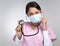 Thats a strong heartbeat. Cropped portrait of an attractive young female healthcare worker wearing a mask and holding up