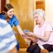 Thats a winning hand. seniors playing cards in their retirement home.