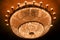 Theater ceiling with illuminated crystal chandelier