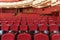 Theater hall for visitors with beautiful chairs of Burgundy-red velvet chairs before the show