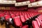 Theater hall for visitors with beautiful chairs of Burgundy-red velvet chairs before the show