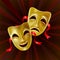 Theater masks on a red background.