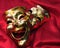 Theater masks on red velvet