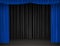 Theater stage with blue and black curtains