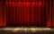 Theater stage with a red curtain, ready for a show.