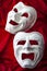 Theatre and opera concept with theatrical masks in vertical shot on red velvet. In Greek mythology Thalia was the Muse of comedy