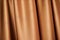 theatrical golden curtain. close-up of golden curtain - photographed, not illustrated. Golden curtain background.